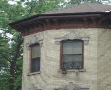 Featured are the elaborate carved stone lintels above the windows and the frieze below the roofline.; Martina Braunstein, 2007.
