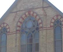 Of note is the Star of David which appears in the original window.; Kendra Green, 2007.