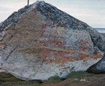 View of Parry's Rock Wintering Site, showing the existence of the carvings by J. Fisher and others relating to exploration in the Arctic, 1980.; Parks Canada Agency / Agence Parcs Canada, S. Mackenzie, 1980.