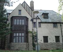 Of note are the carvings on the projecting window bay and the stone chimney.; Martina Braunstein, 2007.