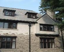 Of note are the stone and stucco construction and tall, narrow, multi-paned windows.; Martina Braunstein, 2007.