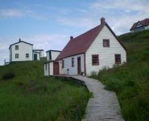 View of side and main facades with pathway leading to main door.; HFNL 2008
