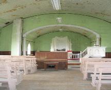 View of church interior, featuring pressed copper tile and ornate pulpit, 2004.; Government of Saskatchewan, Lisa Dale-Burnett, 2004.