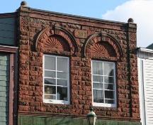 Detail of upper storey of front facade decorative carving,  91 Victoria Street East, Amherst, NS, 2007.; Heritage Division, NS Dept of Tourism, Culture and Heritage, 2007
