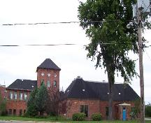 Front view showing various additions to original structure; City of Fredericton