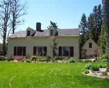 Thorne Cottage, front view (east), showing the garage at the rear; City of Fredericton