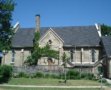 Of note are the buttress, lancet windows with hood moulds and the central gable.; Kendra Green, 2007