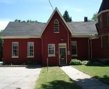 Of note is the gothic window in the gable and the 6 over 6 institutional windows.; Kendra Green, 2007