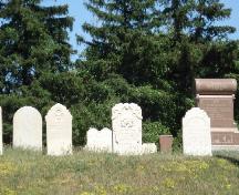 Featured are some of the gravestones marking the graves of early pioneers.; Kendra Green, 2007.