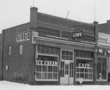 Archival view of the primary elevation of the Former Rex Cafe Site, the building that once occupied the present 125th Commemorative Park, Carberry, 1942.; Carberry Plains Archives, 1942