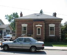 Of note is the low hip roof.; Beatrice Tam, 2008.