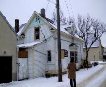 View of the Rehwinkel Parsonage looking toward the southwest corner of the house, with the facade facing 110 Avenue (January 2005); City of Edmonton, 2005