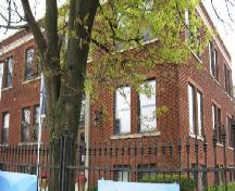 Of note are the decorative brick window surrounds and concrete sills.; Chelsey Tyers, 2008.