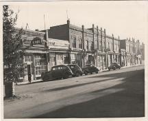 Archival view showing the early quality and condition of the east side of the Historic Downtown Carberry heritage district, Carberry, 1944.; Historic Resources Branch, Manitoba Culture, Heritage, Tourism and Sport, 2007, Courtesy Carberry Plains Archives, 1944