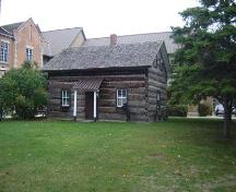 Featured is the relocated log cabin.; Kayla Jonas, 2007.