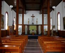 Interior view, to the nave and altar, of the Monseigneur Tache Historic Site, Ste. Genevieve, 2005; Historic Resources Branch, Manitoba Culture, Heritage and Tourism, 2005