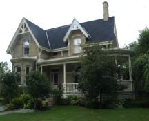 Of note is the wrap around veranda.; Kayla Jonas, 2008.