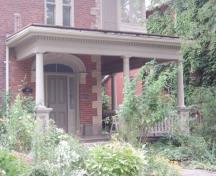 Featured is the decorative carved stone lintel over doorcase.; Paul Dubniak, 2008.