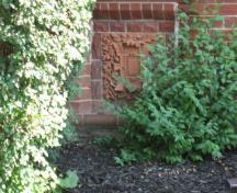 Featured is the raised terra cotta panel below the ground floor window of the facade.; Beatrice Tam, 2008.
