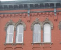 Of note are the double hung windows with frames, hoodmolds, keystones, and stone sills.; Chelsey Tyers, 2008.