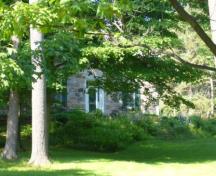 Of note is the front door highlighted by a flat, multi-light transom and sidelights.; Kirsten Pries, 2008.