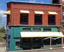 The Flat Iron Building was rebuilt from a wooden structure in 1917 to keep up with the modern look of Moncton's downtown. ; Moncton Museum