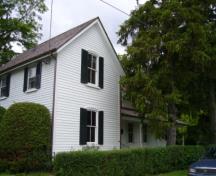 Of note are the two-over-two double hung windows with shutters.; Kirsten Pries, 2008.