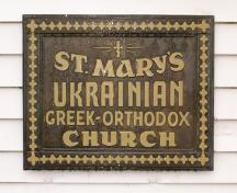 Exterior view of historic plaque, side of church, 2004; City of Surrey 2004