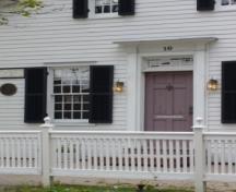 Of note is the front entrance with double panel door, recessed transom and Doric order pilasters.; Kirsten Pries, 2008.