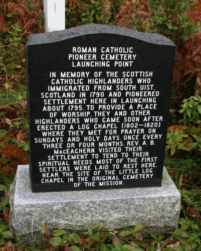 Showing monument at the base of the cross