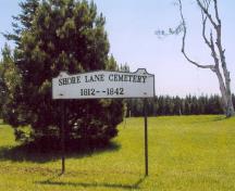 Showing identification sign on grounds; PEI Genealogical Society, George Sanborn Jr., 2009