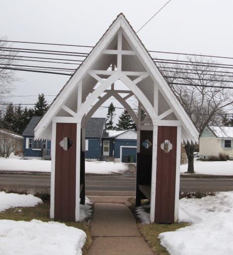Showing lych gate in front of the church