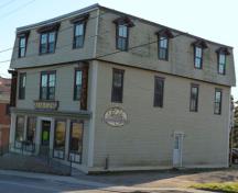 This image shows a view of the northeast corner of the the former hardware store, harness shop and West's drug store, complete with a soda fountain, now Ford's Pharmacy.; Village of Hillsborough