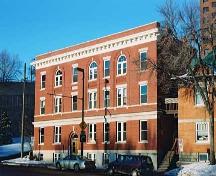 Parkview Apartments - note the typical Edwardian-era and Classical Revival detailing in the series of arched windows, the arched entrance, the large upper cornice and the rectangular brick composition (2004).; City of Edmonton, 2004