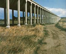 General view of Brooks Aqueduct, showing the flume and columns.; Parks Canada Agency / Agence Parcs Canada.