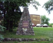 General view of the stone cairn erected by the Historic Sites and Monuments Board of Canada, 2008.; Parks Canada Agency / Agence Parcs Canada, Blair Philpott, 2008.