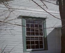Detail view of the Former Pickering Town Hall, showing a large paned window with simple entablature and surround, 2005.; Public Works and Government Services Canada / Travaux publics et Services gouvernementaux Canada, 2005.