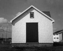 Façade of the Fog Alarm Building, showing the large opening on the north façade, 1990.; Parks Canada Agency / Agence Parcs Canada, 1990.