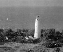 Aerial view of the Lighttower, showing the regular position and shape of its window and door openings, 1982.; David Baird, "Lighthouses of Canada," Canadian Geographic Journal, June/July 1982, p.47.