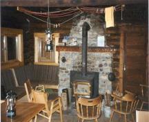 Interior of the Stanley Mitchell Alpine Hut, demonstrating the rustic design of the building, 1998.; Parks Canada Agency\Agence Parcs Canada, 1998.