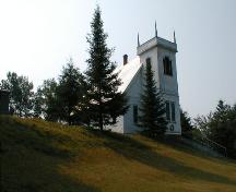 Four Gothic pinnacles adorn the upper corners of the tower, the steeple burned circa 1950.; PNB 2005