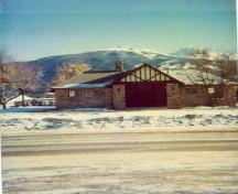 General view of the Rescue Building, showing the the projecting entrances and gables with imitation half-timbering and stucco on the principal façade, 1950.; Parks Canada Agency / Agence Parcs Canada, 1950.