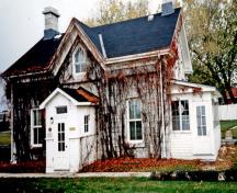Façade of RMC Building 2, showing the complementary dressed and roughened stone surfaces, 1993.; Parks Canada Agency / Agence Parcs Canada, 1993.