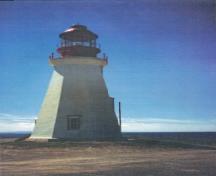 General view of the Tower, showing the hexagonal massing of the tower that rises to a slightly flared lantern base and prominent lantern, 1990.; Canadian Coast Guard / Garde côtière canadienne, 1990.