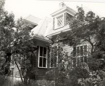 View of the exterior of Limberlost, showing the hipped-roof dormers, 1992.; Parks Canada Agency / Agence Parcs Canada / Historica Resources Ltd., 1992.