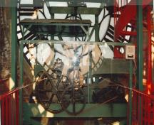 View from inside the Clock Tower of one of the clock faces and its mechanisms, 1996.; Parks Canada Agency / Agence Parcs Canada, Christiane Lefebvre, 1996.