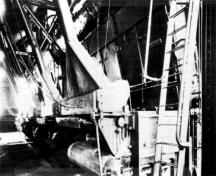 Interior view of the Ottawa Electric Railway Company Steam Plant, showing the former automatic stokers and boilers in the boiler room.; COA, OER Collection, CA-15030