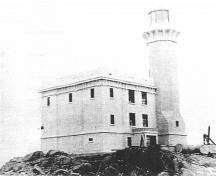 Historical image of the Triple Island Light Tower, 1921.; Parks Canada Agency / Agence Parcs Canada, 1921.