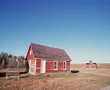 Corner view of the Post Office showing the strong, largely asymmetrical pattern of windows and doors, 1999.; Parks Canada Agency / Agence Parcs Canada, J. Pleau, 1999.
