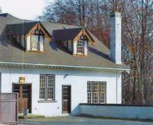 View of the southern facade of the Stable / Garage emphasizing the dormer windows and roof gables, 2000.; Department of National Defence / Ministère de la Défense nationale, D. Cebula, 2000.